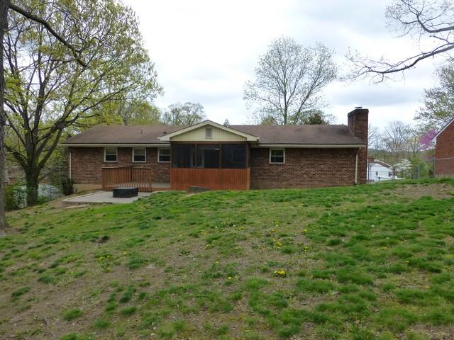 3453 Wedgewood Road Southwest Roanoke, VA 24018 - Photo 22 of 38 a front view of a house with a garden and trees