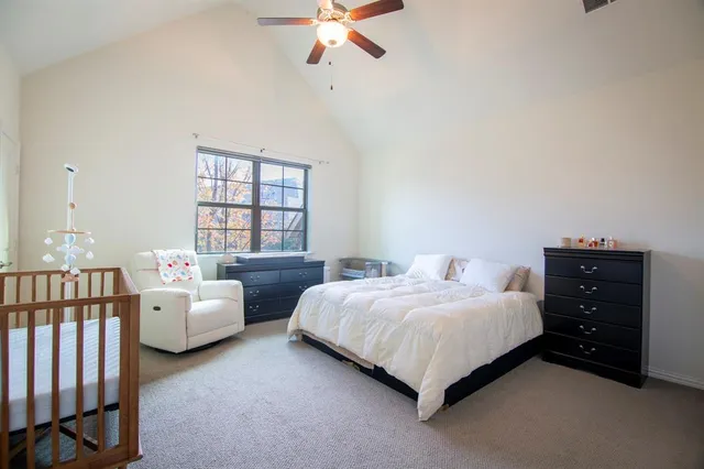 a bedroom with two beds and a window