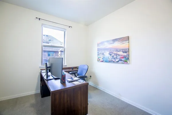 a view of a workspace with furniture