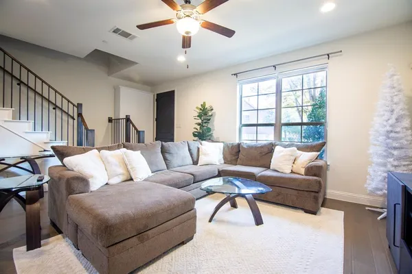 a living room with furniture and a large window