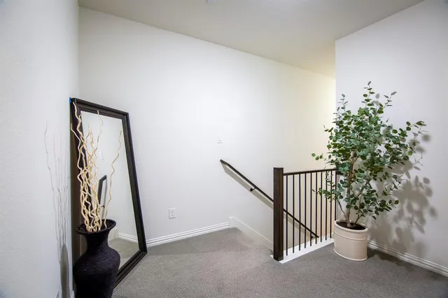 a view of a hallway with stairs