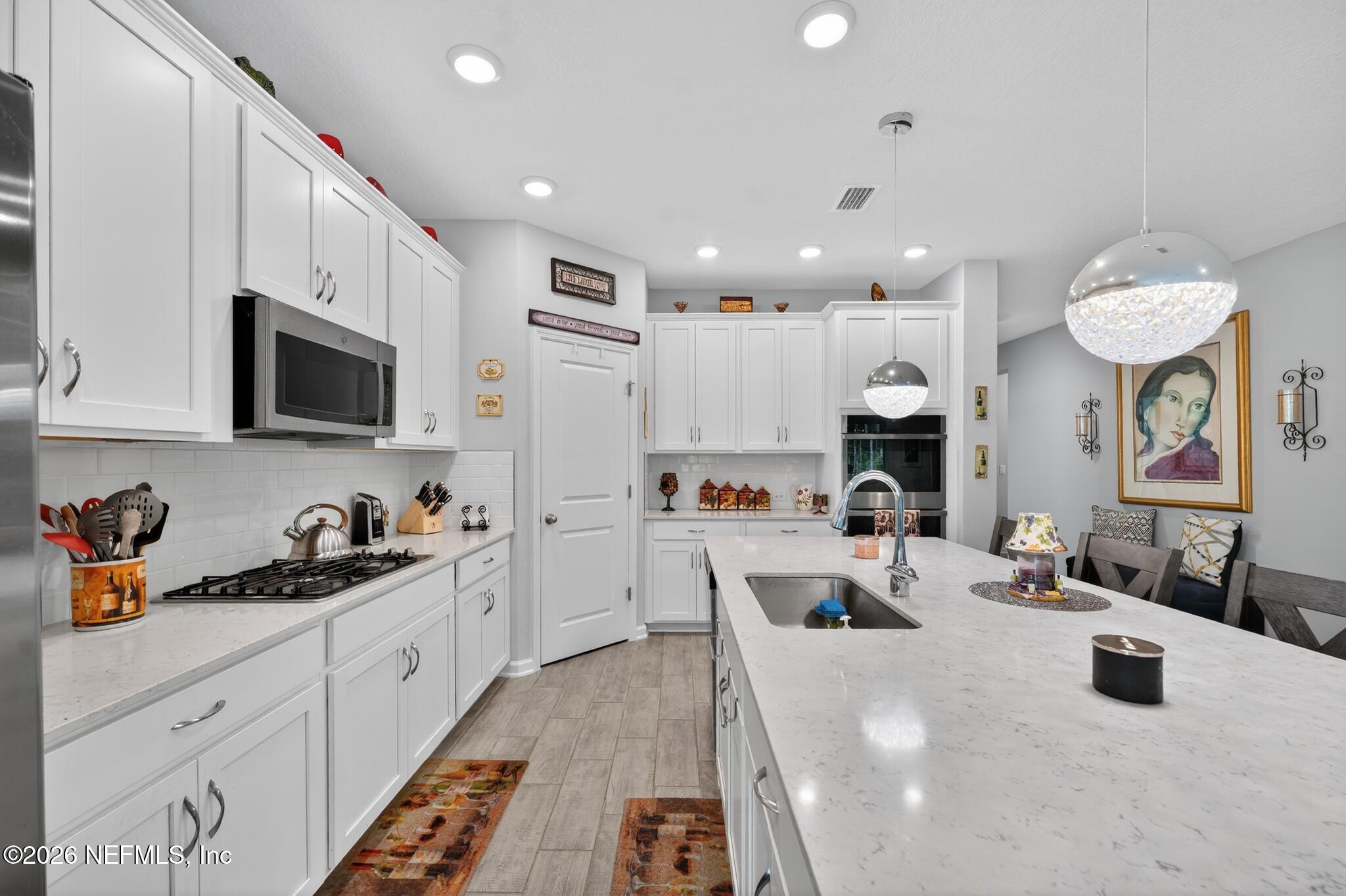 75505 Banyan Way Yulee, FL 32097 - Photo 10 of 30 a large white kitchen with lots of counter top space