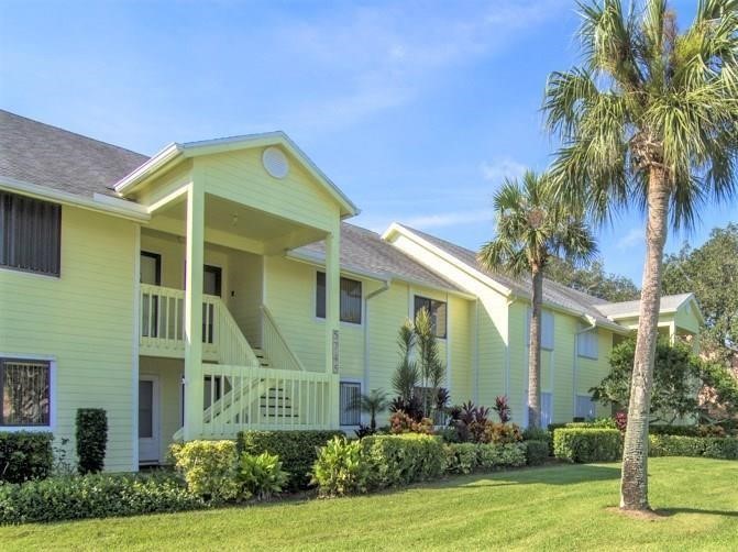 5745 Pelican Pointe Drive, Unit 4 Sebastian, FL 32958 - Photo 1 of 27 a front view of a house with garden