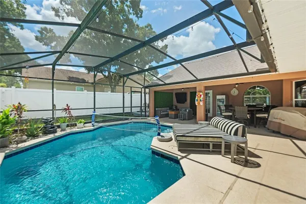 a view of backyard with furniture and tub