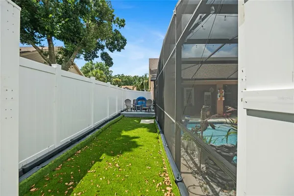 a view of a house with a yard and a garden