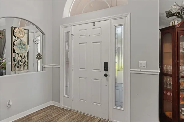 wooden floor with white walls