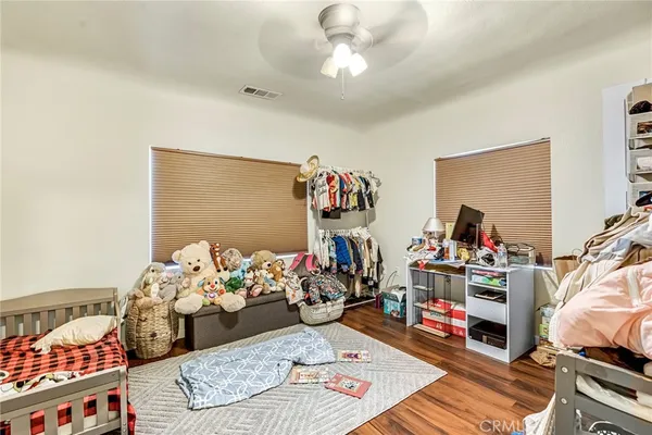 a bedroom with furniture and a chandelier