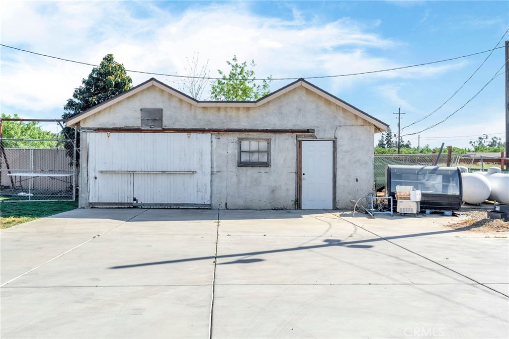 24110 Ave 14 Madera, CA 93637 - Photo 41 of 43 a backyard of a house with table and chairs