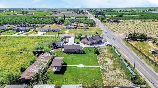 an aerial view of a house with outdoor space swimming pool and green space