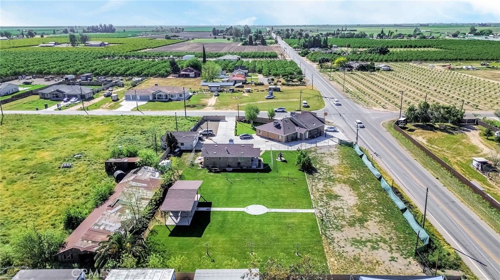 24110 Ave 14 Madera, CA 93637 - Photo 7 of 43 an aerial view of a house with outdoor space swimming pool and green space