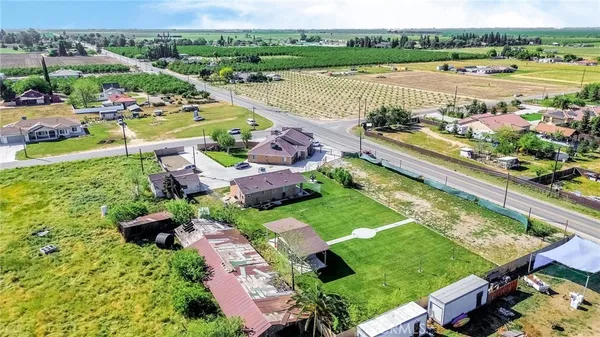an aerial view of a house with outdoor space and lake view