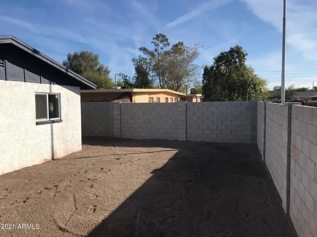 a backyard of a house with lots of green space