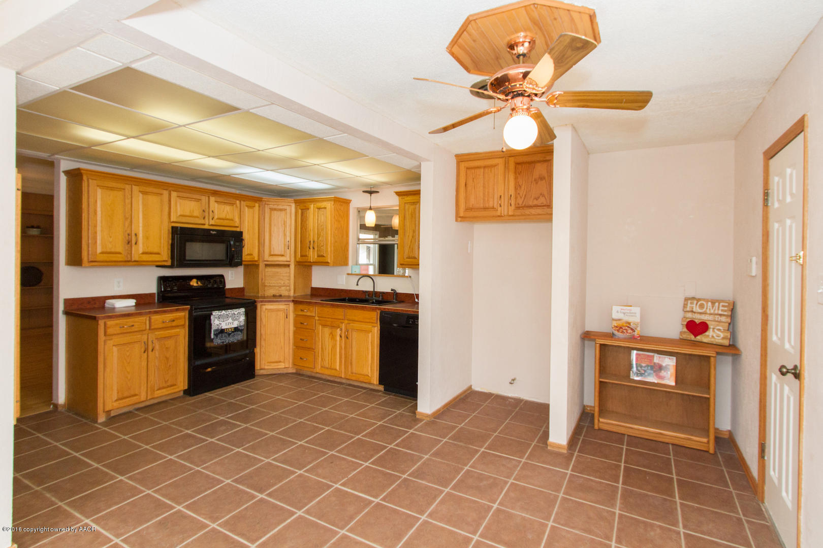 4818 Camp Lane Amarillo, TX 79110 - Photo 11 of 32 a kitchen with stainless steel appliances granite countertop a refrigerator and a stove top oven