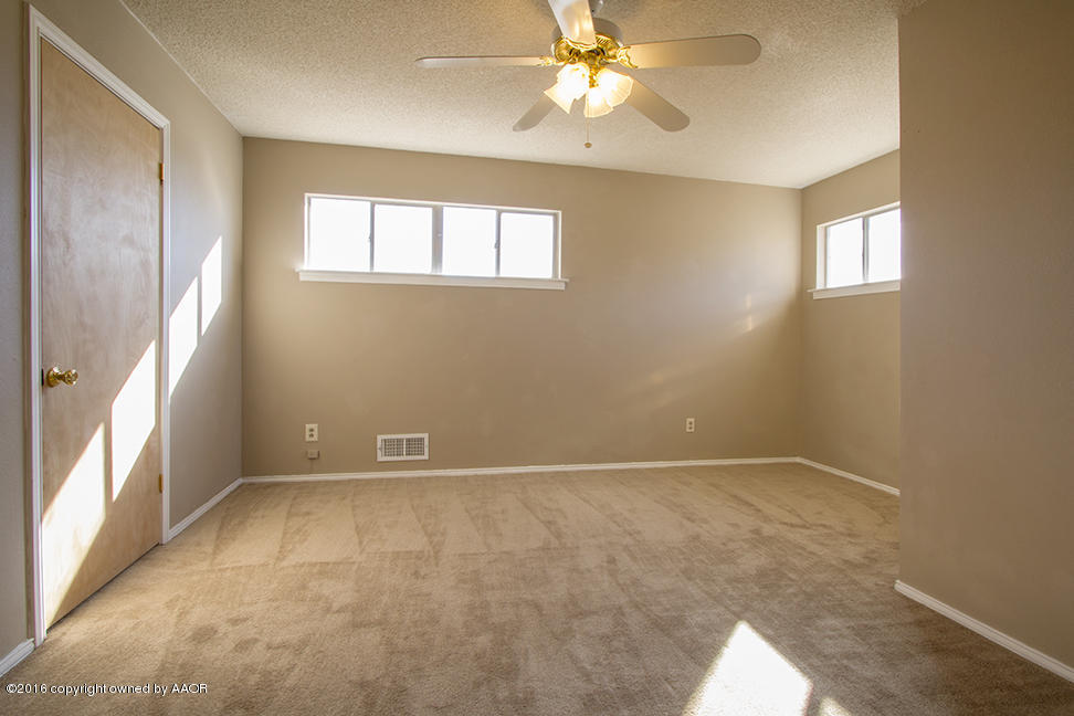 4818 Camp Lane Amarillo, TX 79110 - Photo 24 of 32 a view of an empty room with a window