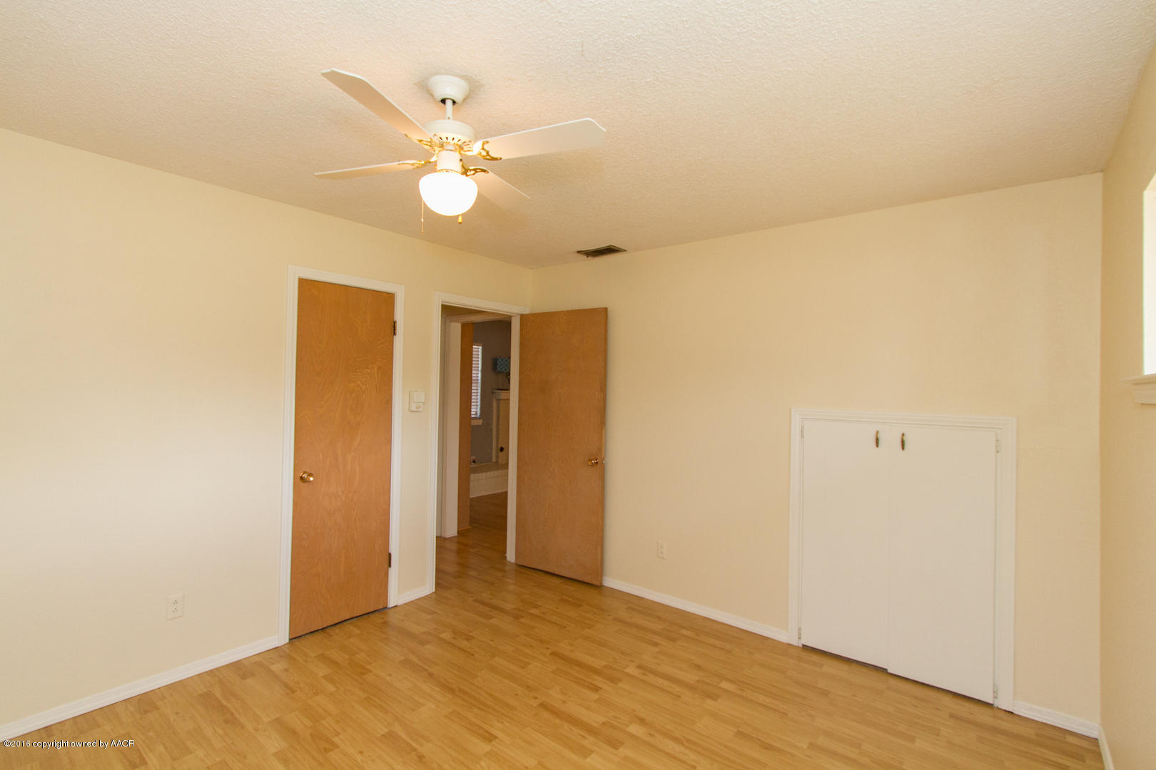 4818 Camp Lane Amarillo, TX 79110 - Photo 29 of 32 a view of an empty room with a ceiling fan