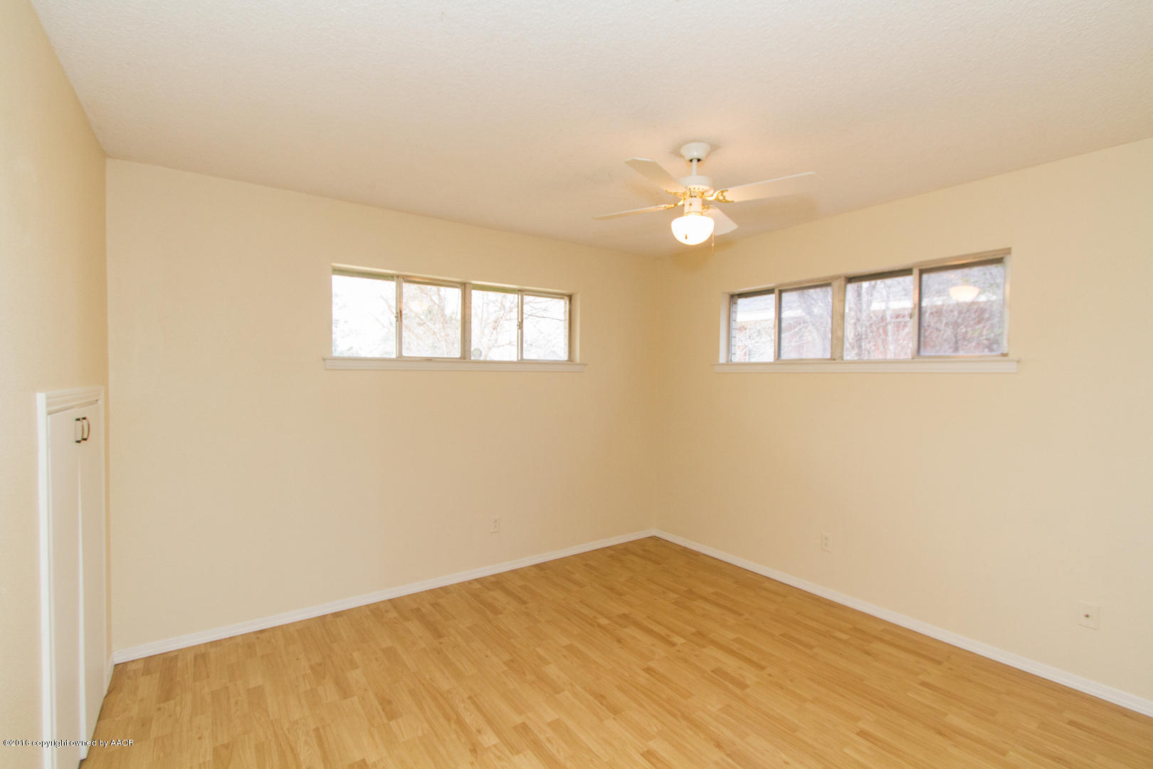 4818 Camp Lane Amarillo, TX 79110 - Photo 30 of 32 a view of empty room with wooden floor and fan