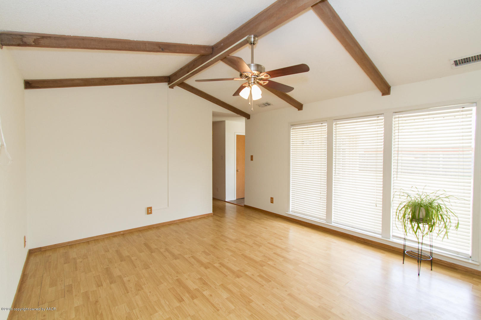 4818 Camp Lane Amarillo, TX 79110 - Photo 5 of 32 a view of an empty room with a window