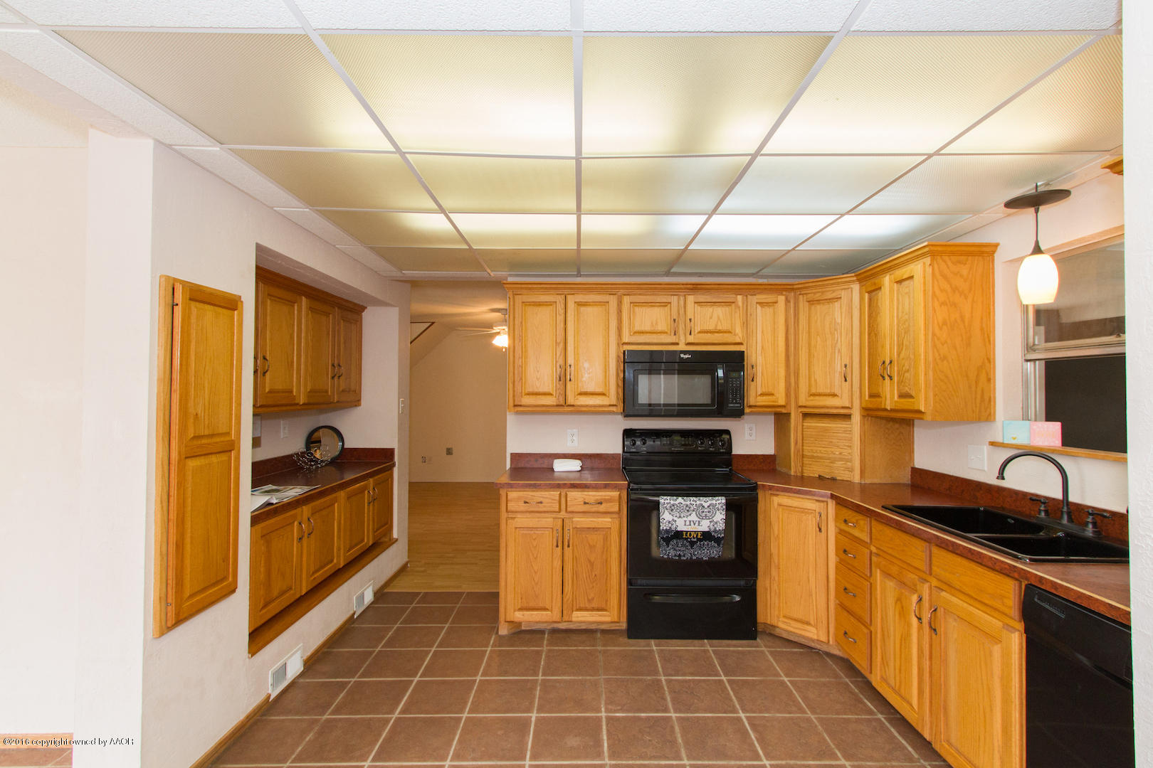 4818 Camp Lane Amarillo, TX 79110 - Photo 10 of 32 a kitchen with stainless steel appliances granite countertop a stove and a sink