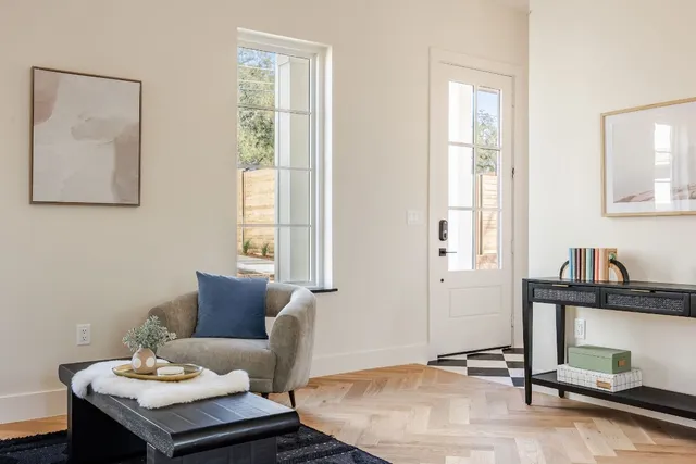 a living room with furniture and window