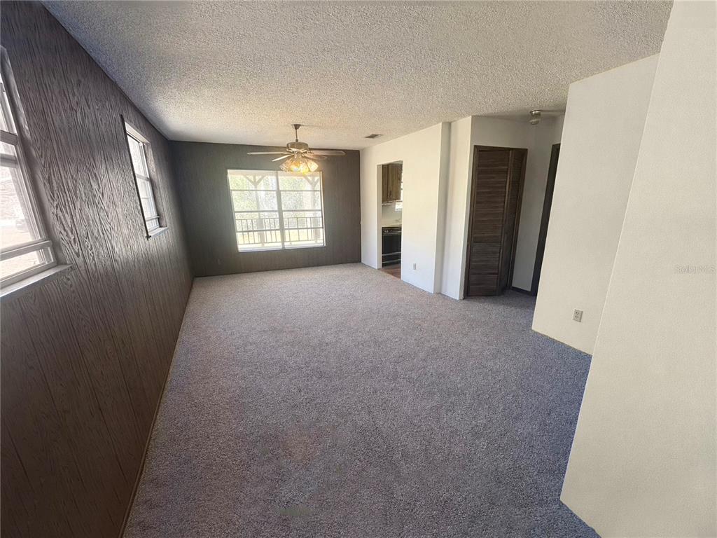 5237 Moore Street St. Cloud, FL 34771 - Photo 14 of 19 a view of a big room with windows and brick walls