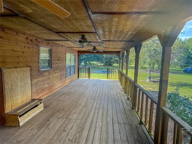 a view of porch with wooden floor and outdoor space
