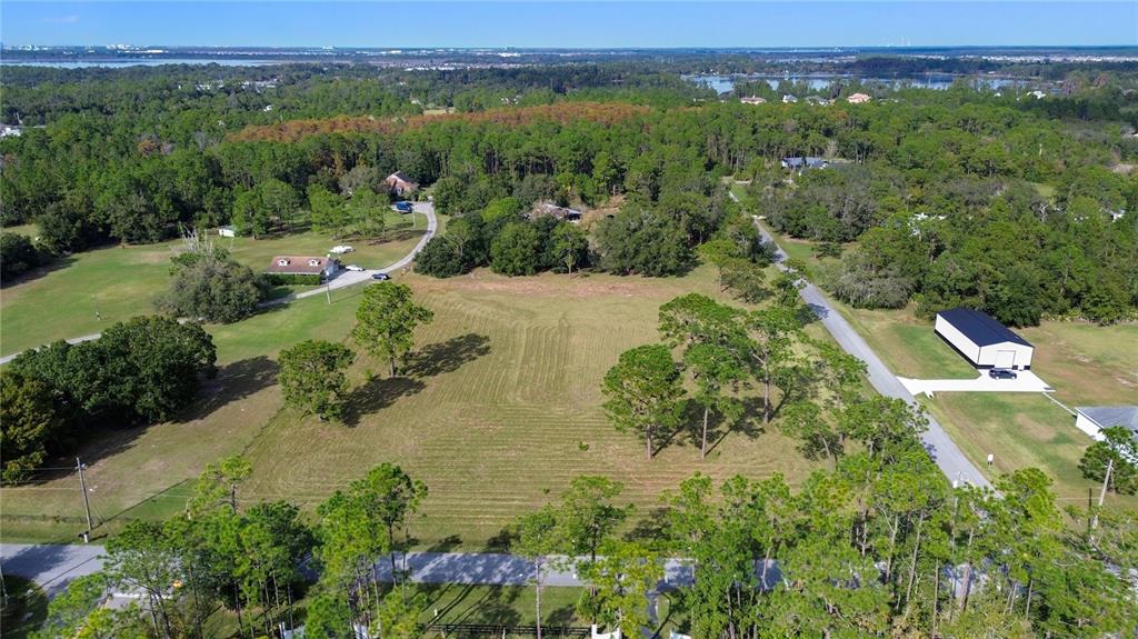 5237 Moore Street St. Cloud, FL 34771 - Photo 4 of 19 an aerial view of residential houses with outdoor space and trees