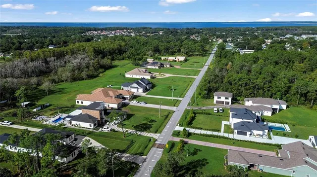 an aerial view of a houses with a garden