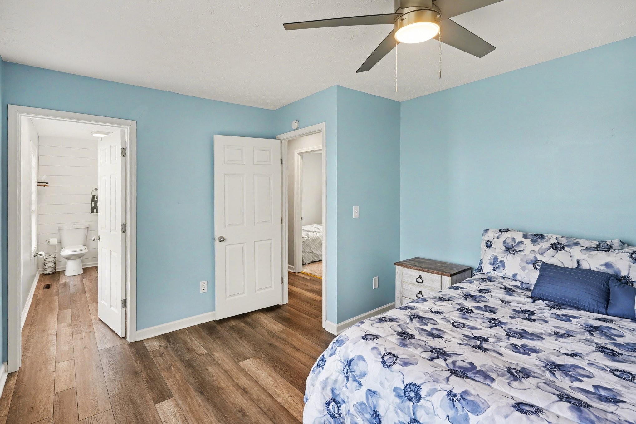 550 Gregory Road Westmoreland, TN 37186 - Photo 11 of 26 a bedroom with a bed and wooden floor