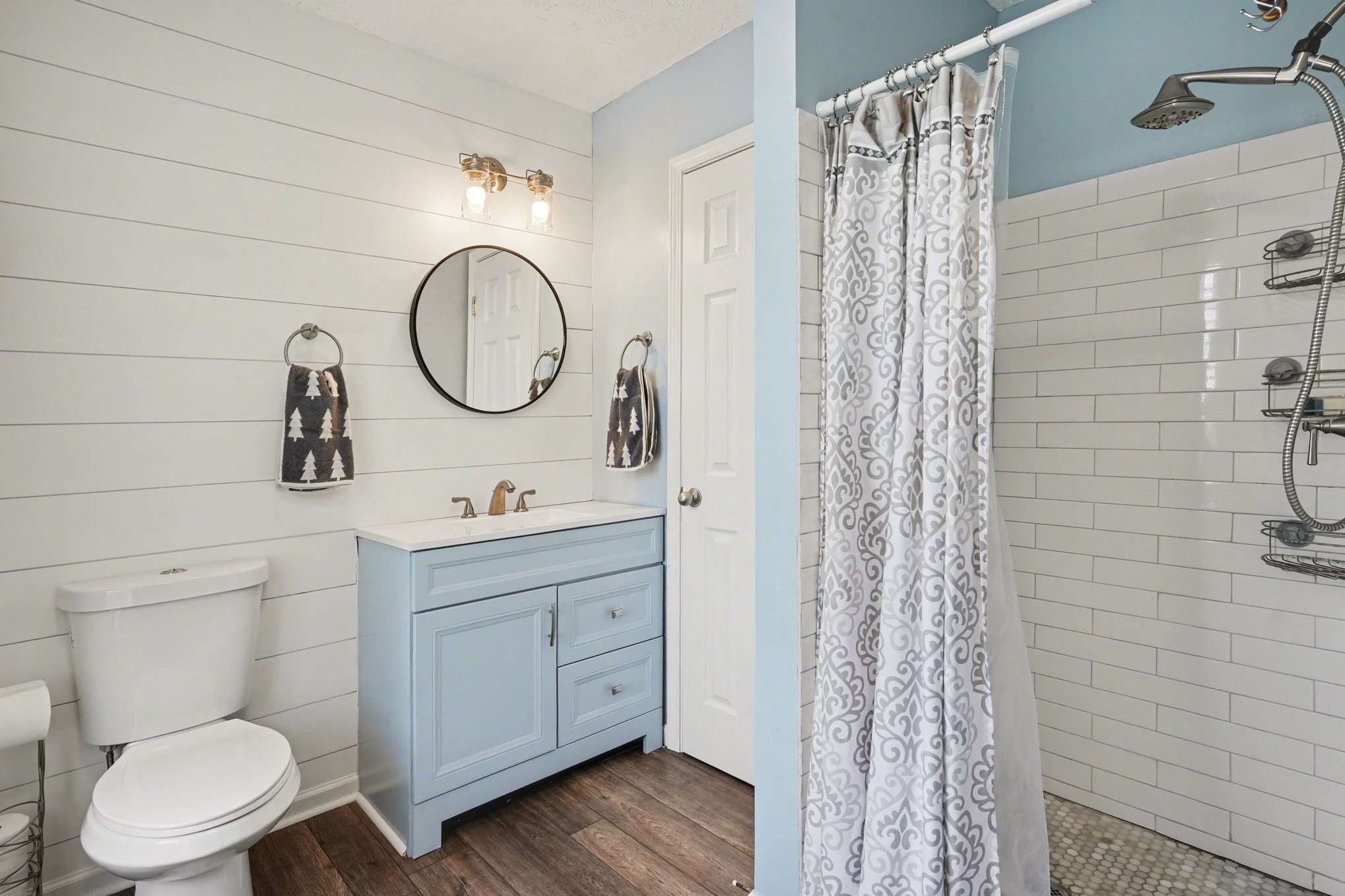550 Gregory Road Westmoreland, TN 37186 - Photo 12 of 26 a bathroom with a toilet sink vanity and mirror