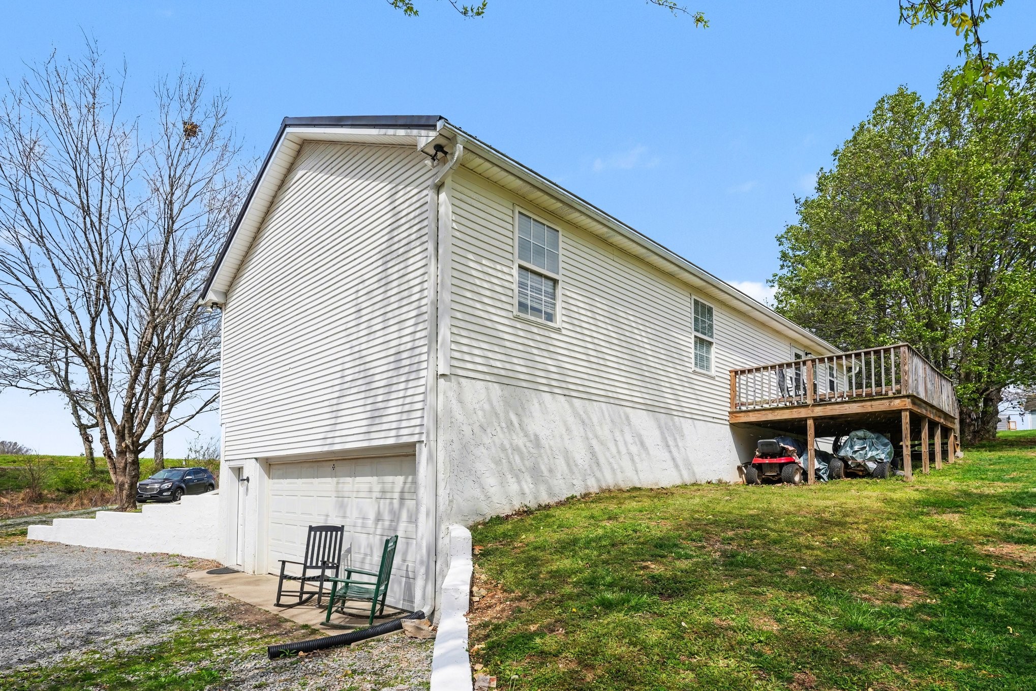 550 Gregory Road Westmoreland, TN 37186 - Photo 24 of 26 a backyard of a house with wooden fence and a large tree