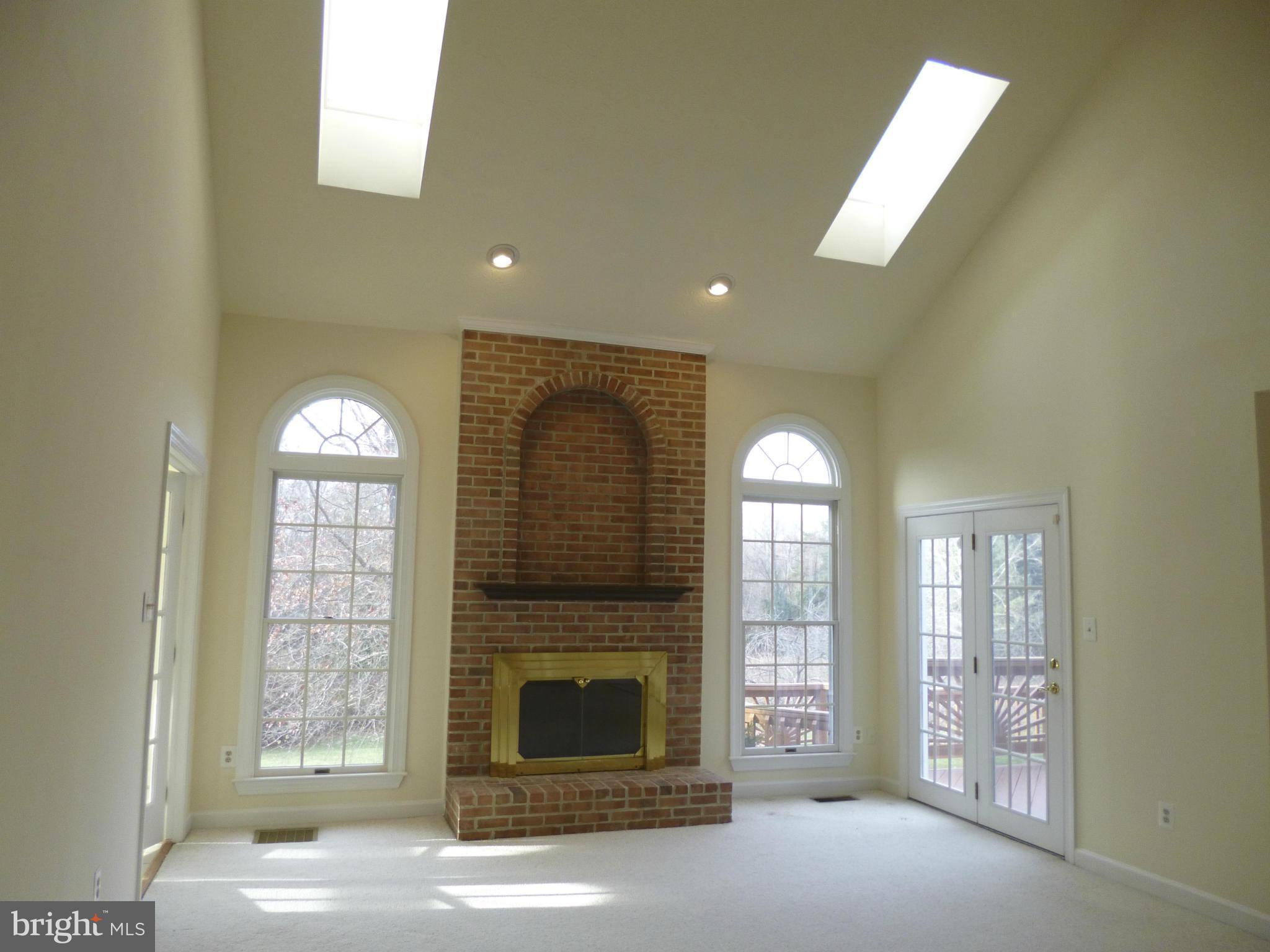 8837 Herons Flight Laurel, MD 20723 - Photo 11 of 29 a view of a livingroom with a fireplace
