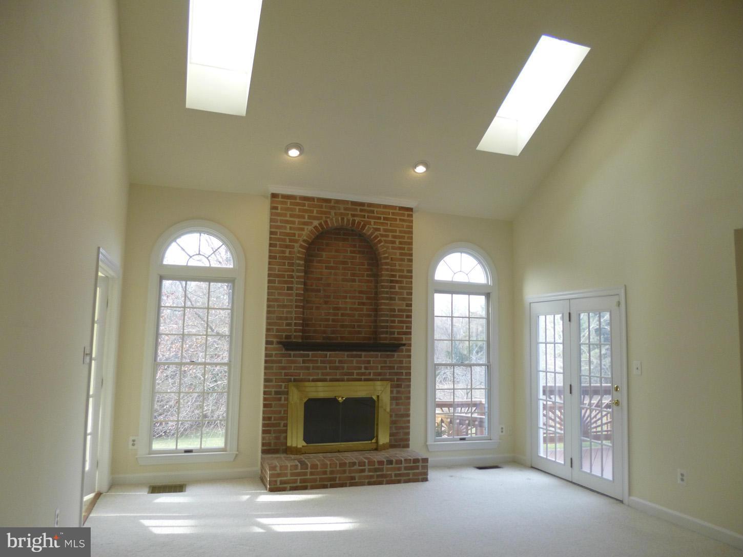 8837 Herons Flight Laurel, MD 20723 - Photo 12 of 29 a view of a livingroom with a fireplace