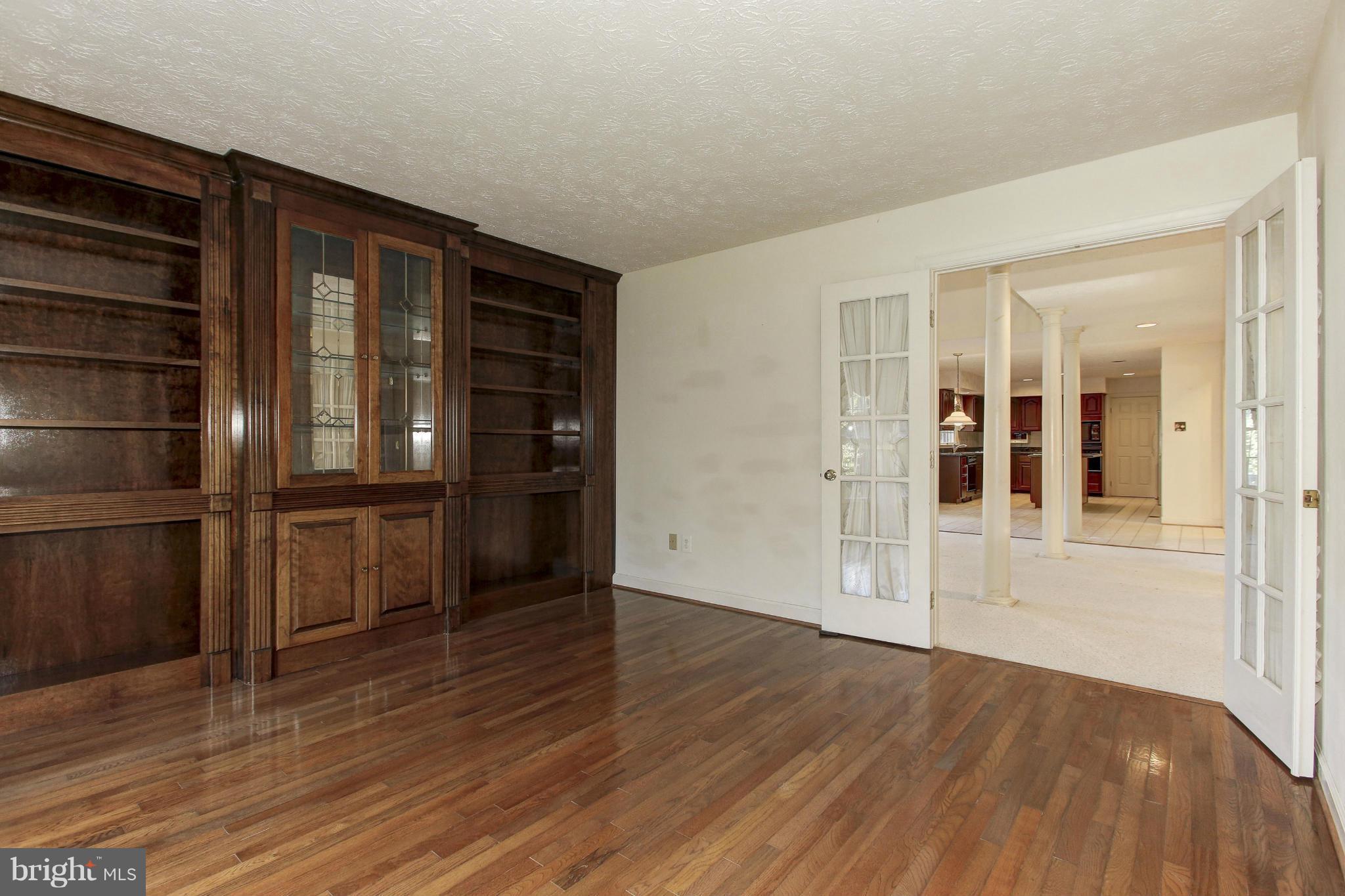 8837 Herons Flight Laurel, MD 20723 - Photo 14 of 29 wooden floor in an empty room