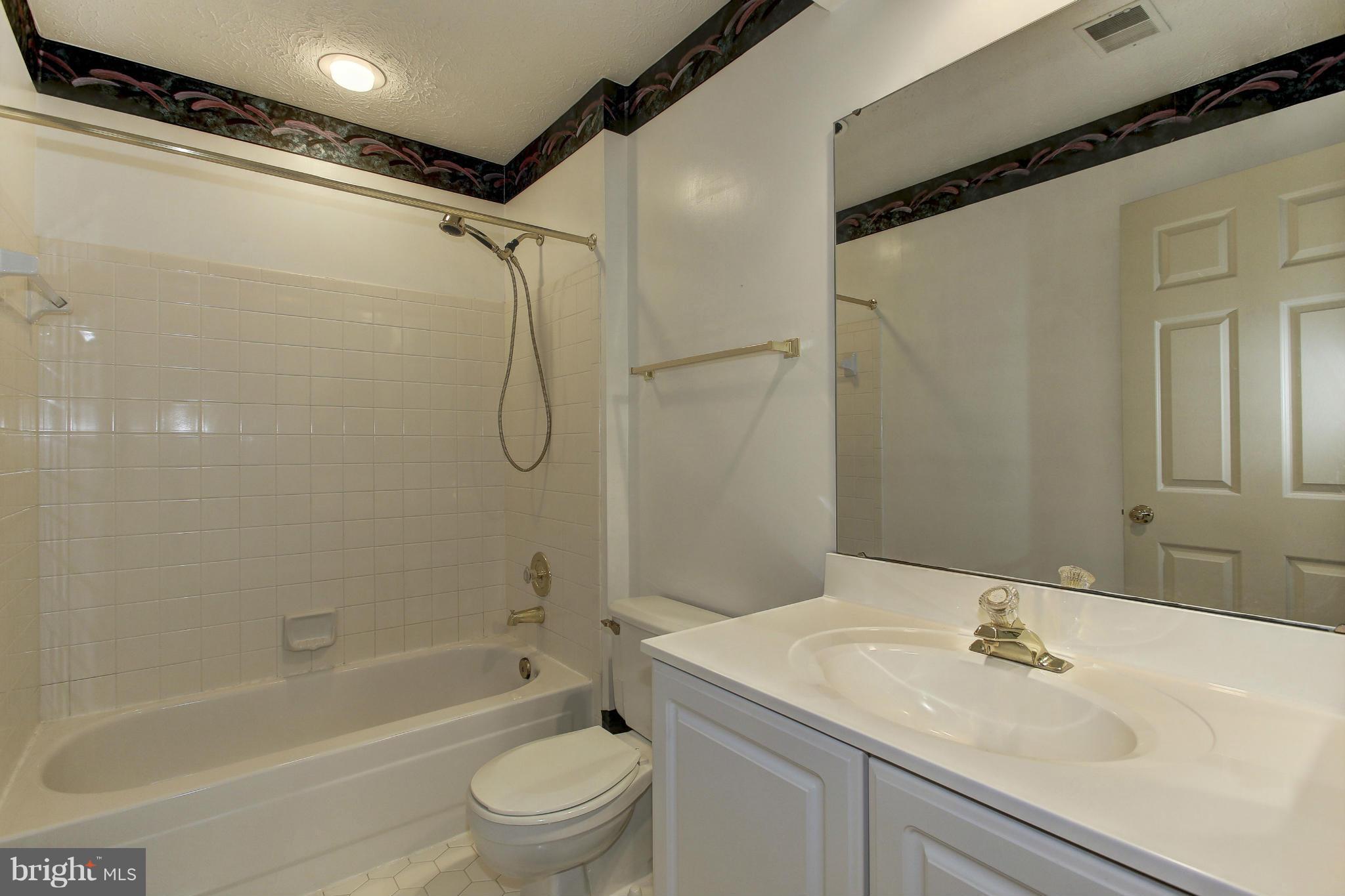 8837 Herons Flight Laurel, MD 20723 - Photo 21 of 29 a bathroom with a sink a toilet and shower