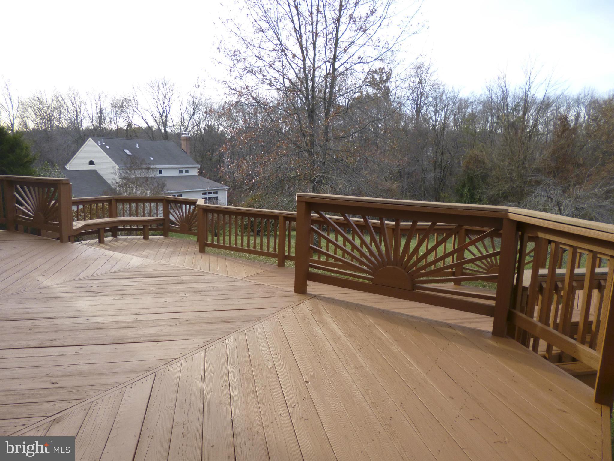 8837 Herons Flight Laurel, MD 20723 - Photo 27 of 29 a terrace view with wooden floor and fence