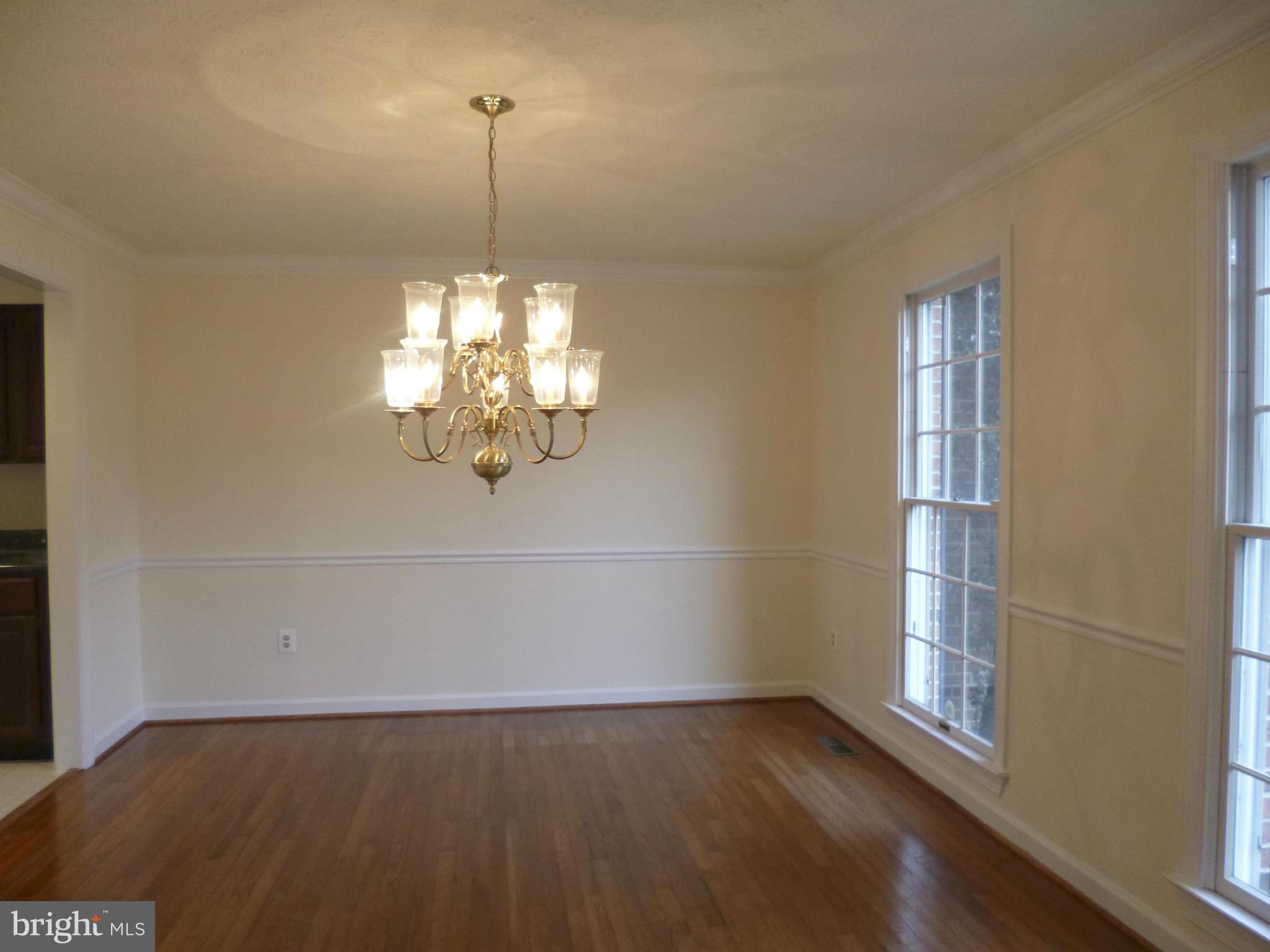 8837 Herons Flight Laurel, MD 20723 - Photo 5 of 29 a view of empty room with wooden floor and fan