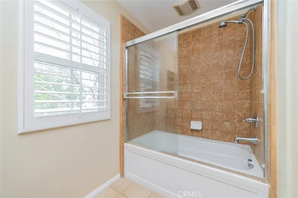 a bathroom with a shower and a bathtub