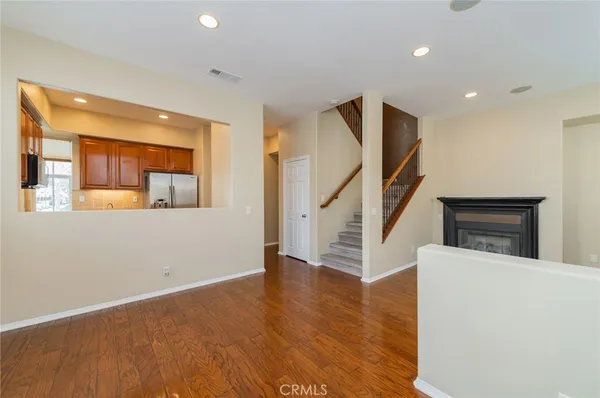 a view of an entryway with wooden floor