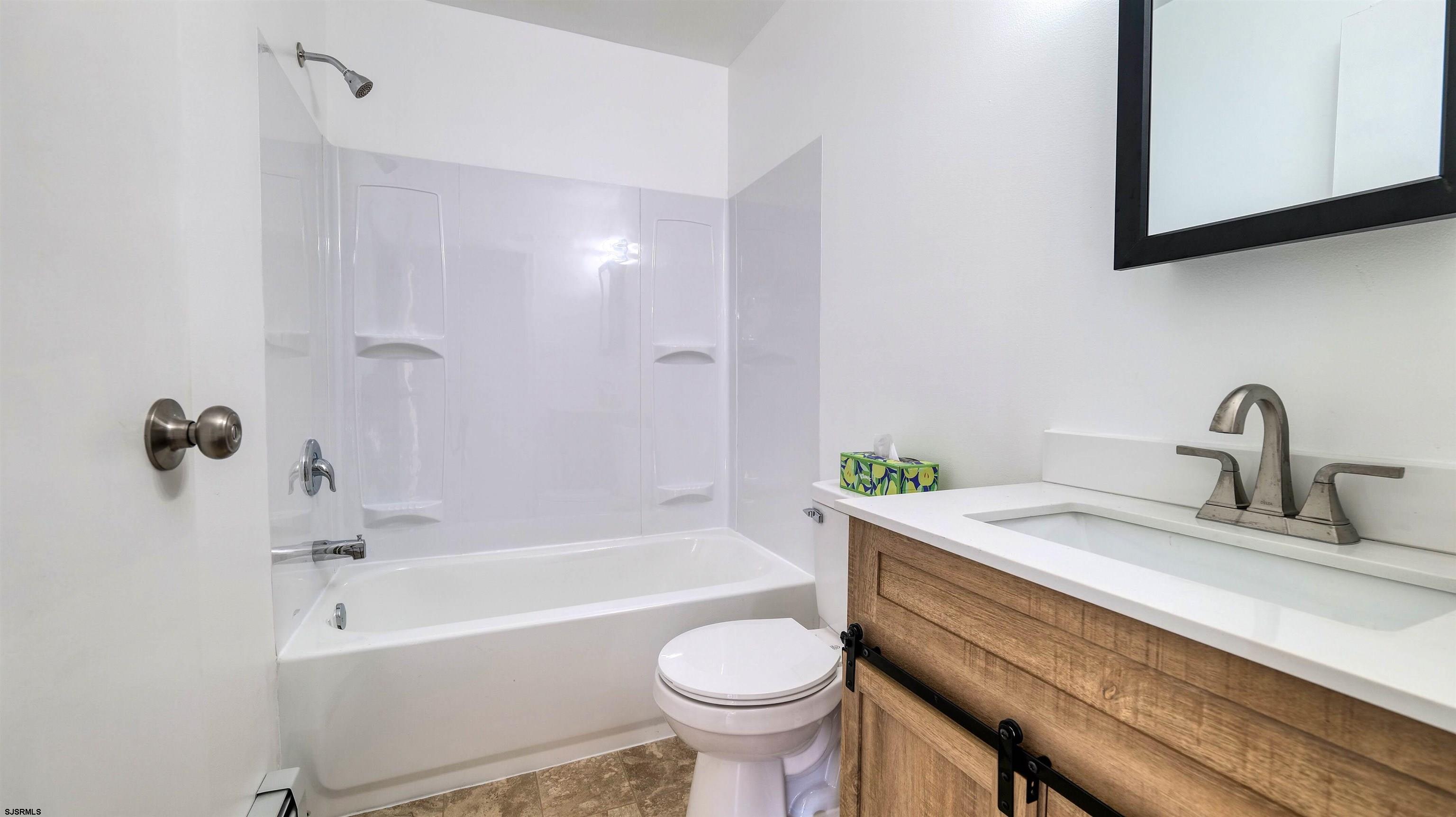 1510 East Wheat Road Vineland, NJ 08360 - Photo 14 of 26 a bathroom with a sink toilet and a bathtub