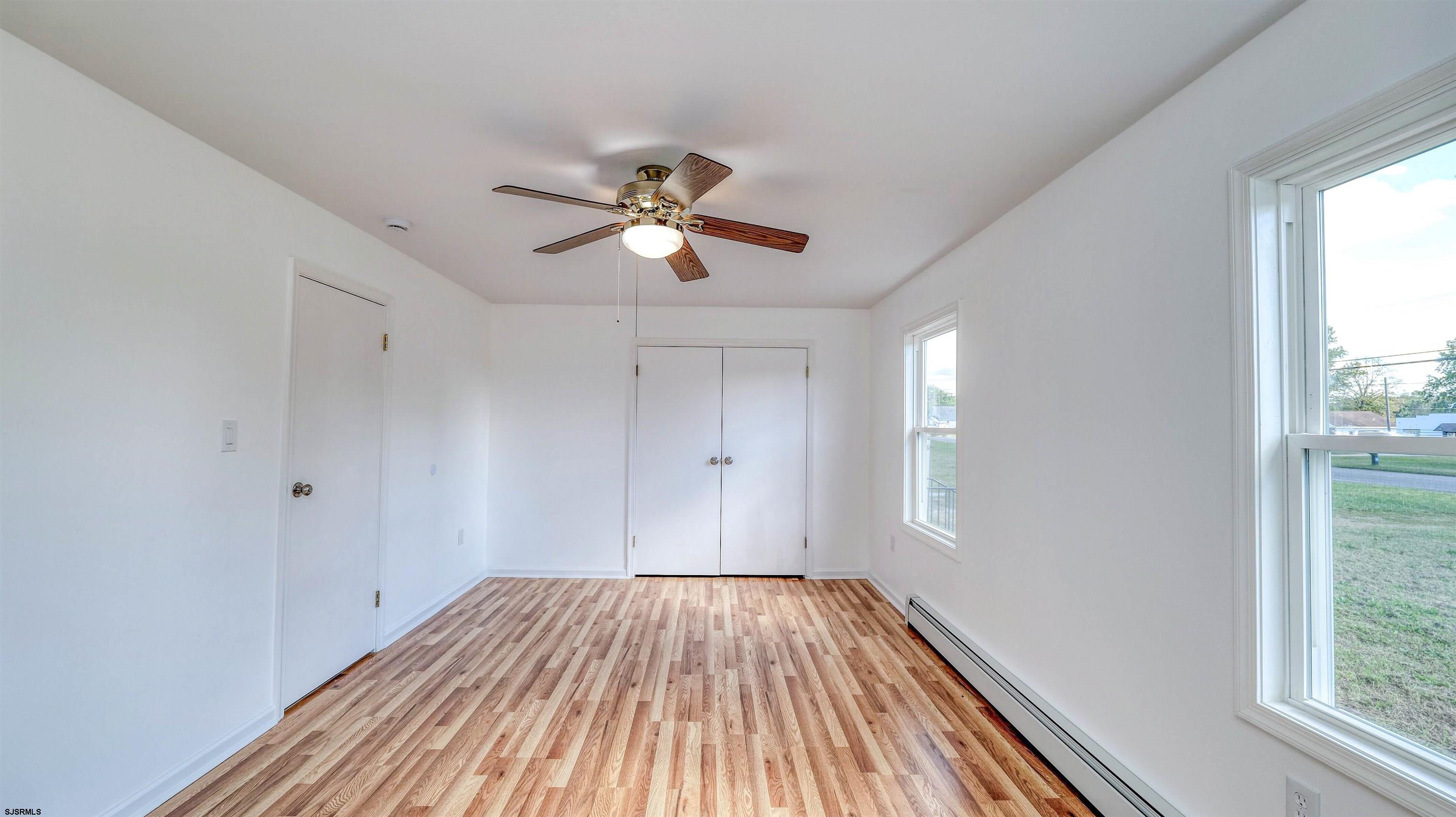 1510 East Wheat Road Vineland, NJ 08360 - Photo 17 of 26 a view of empty room with wooden floor and fan