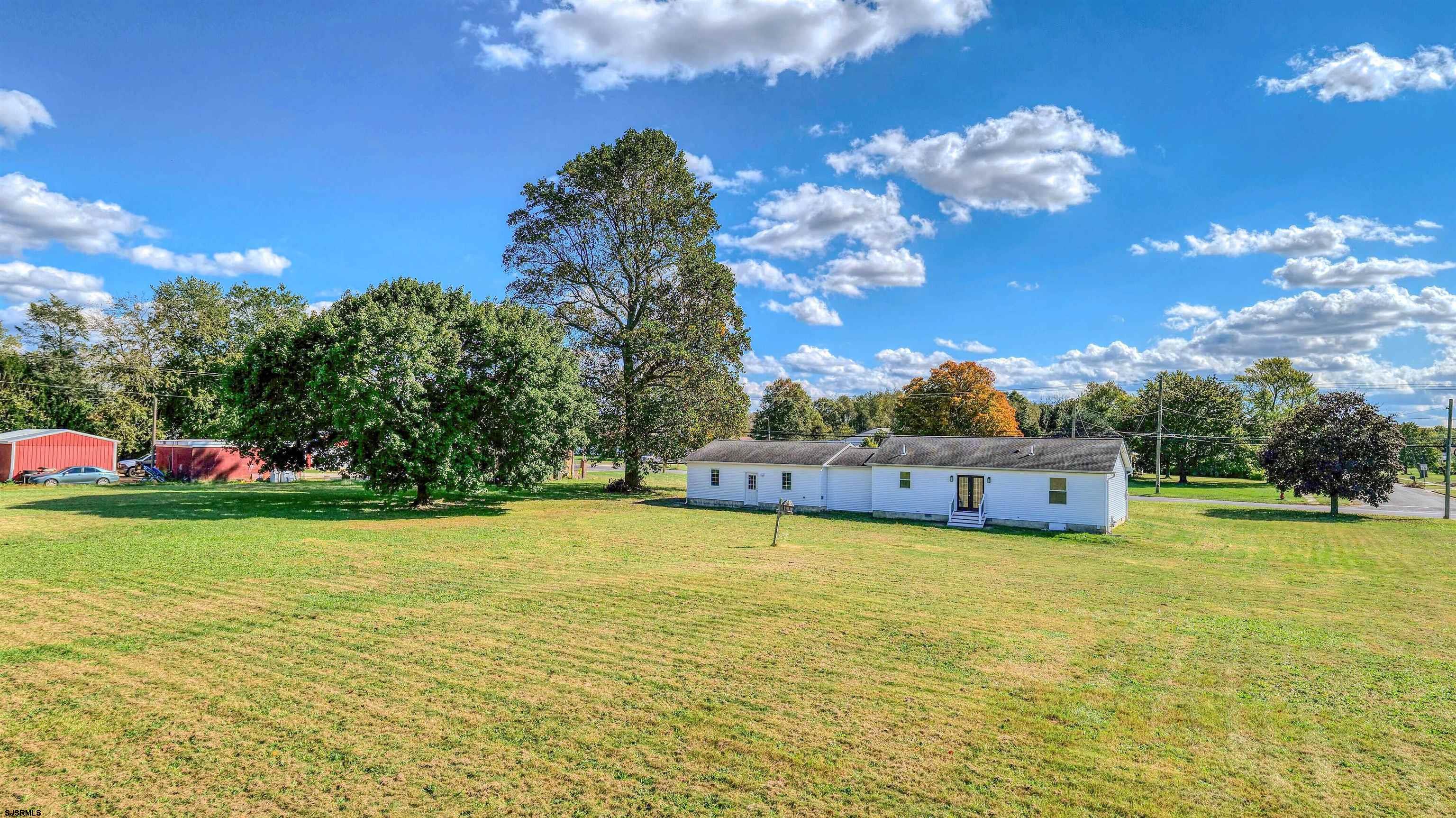 1510 East Wheat Road Vineland, NJ 08360 - Photo 22 of 26 a view of a large pool with an outdoor space and seating area