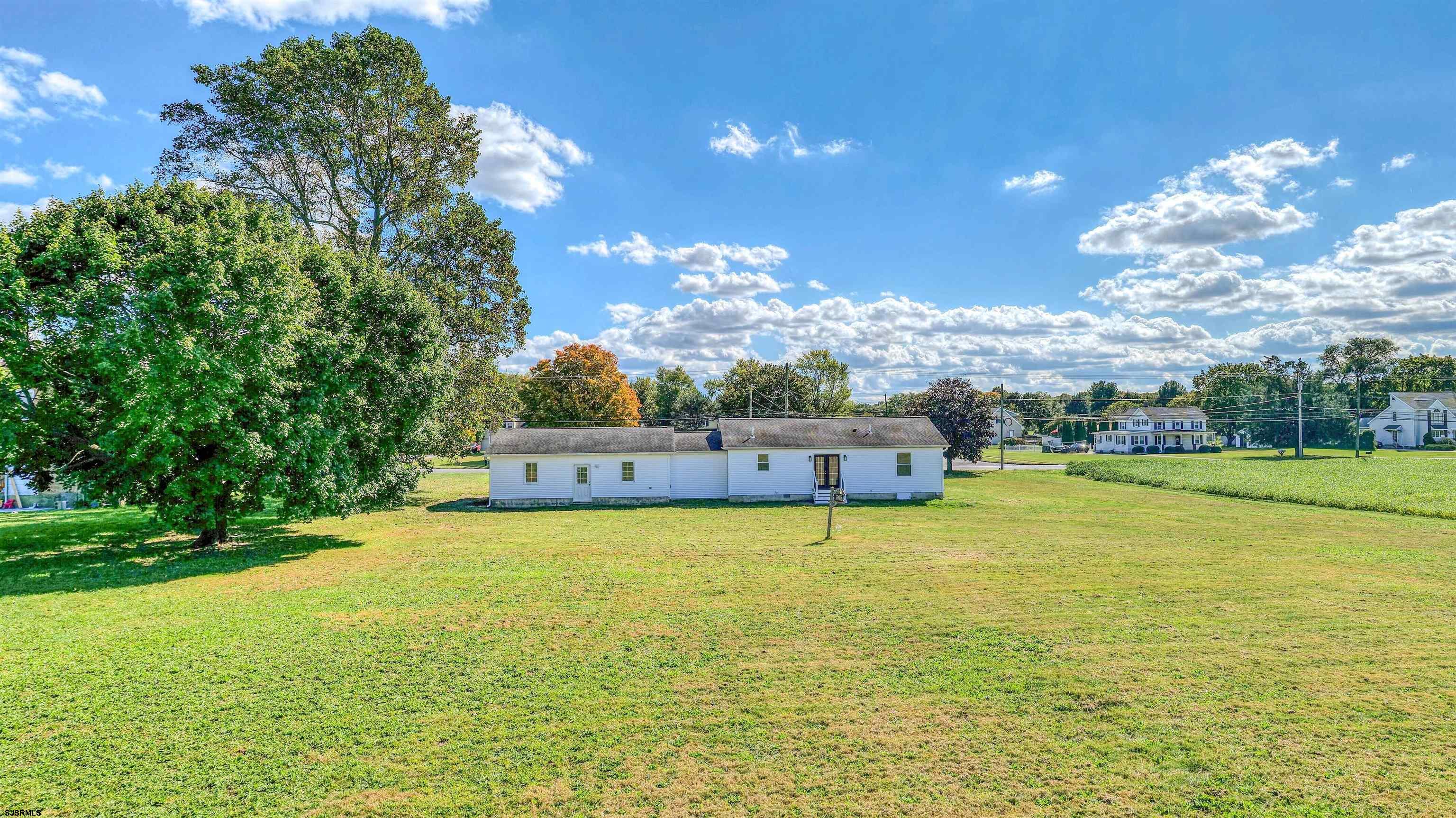 1510 East Wheat Road Vineland, NJ 08360 - Photo 23 of 26 a view of a swimming pool with an ocean view