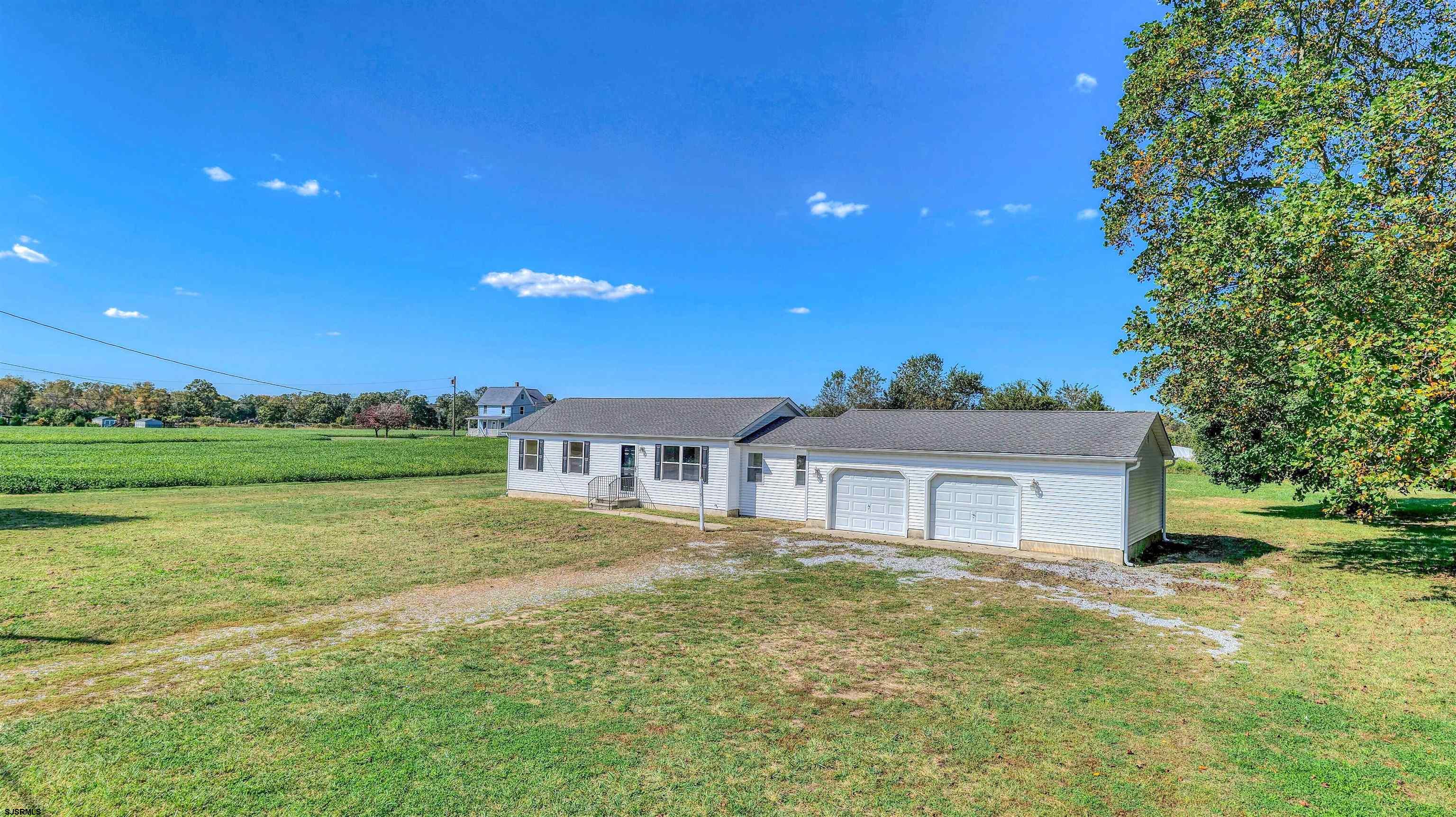 1510 East Wheat Road Vineland, NJ 08360 - Photo 24 of 26 a front view of a house with garden