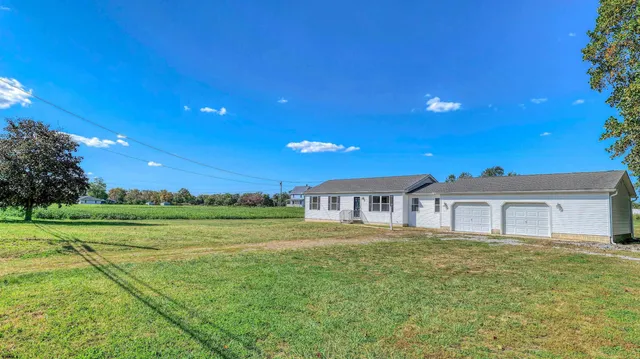 a view of a house with a big yard