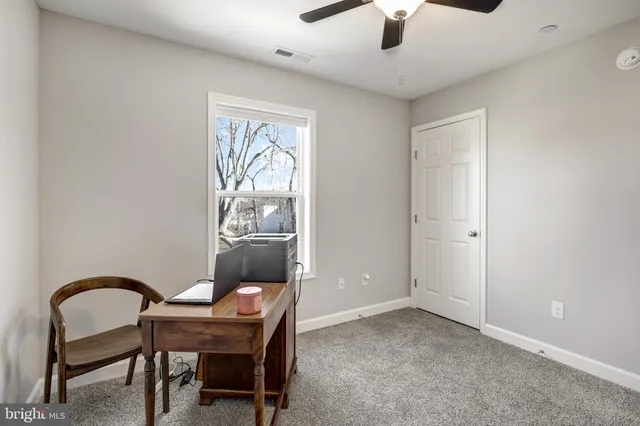 a workspace with furniture and window