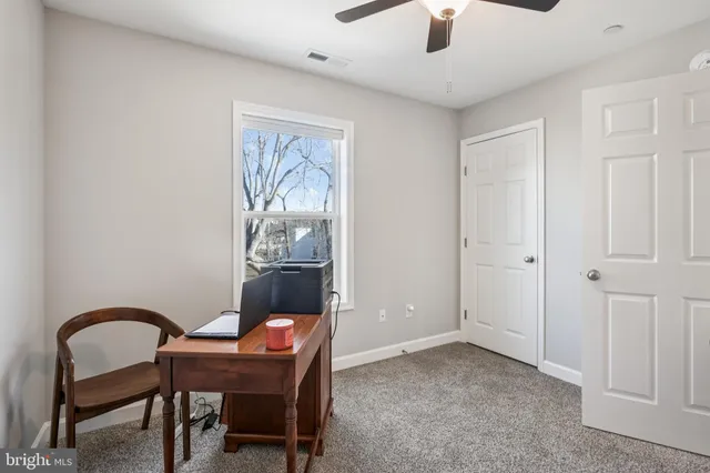 a workspace with furniture and window