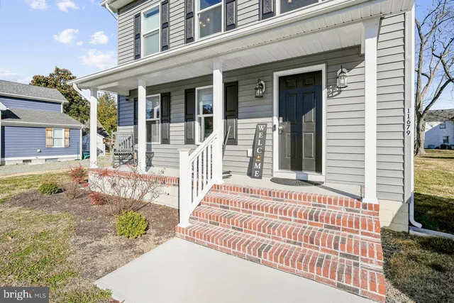 a front view of a house with a porch