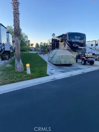 a view of backyard with parked car