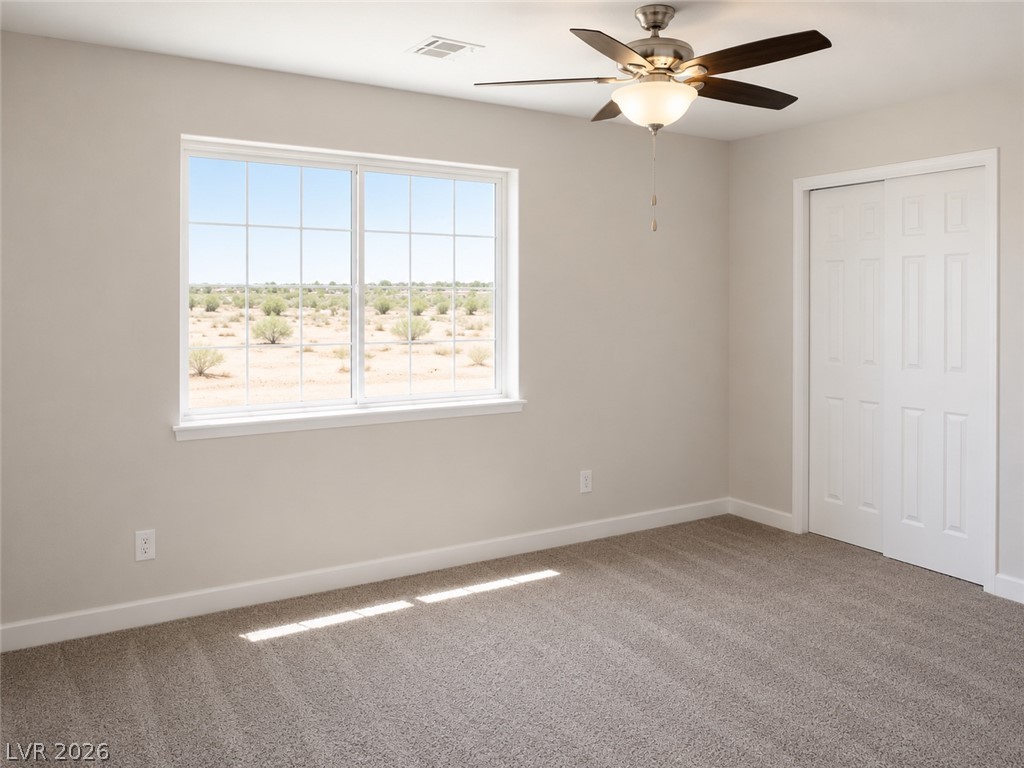 200 East Gamebird Road Pahrump, NV 89048 - Photo 18 of 23 A desert vista through a sun-filled window graces this serene bedroom.