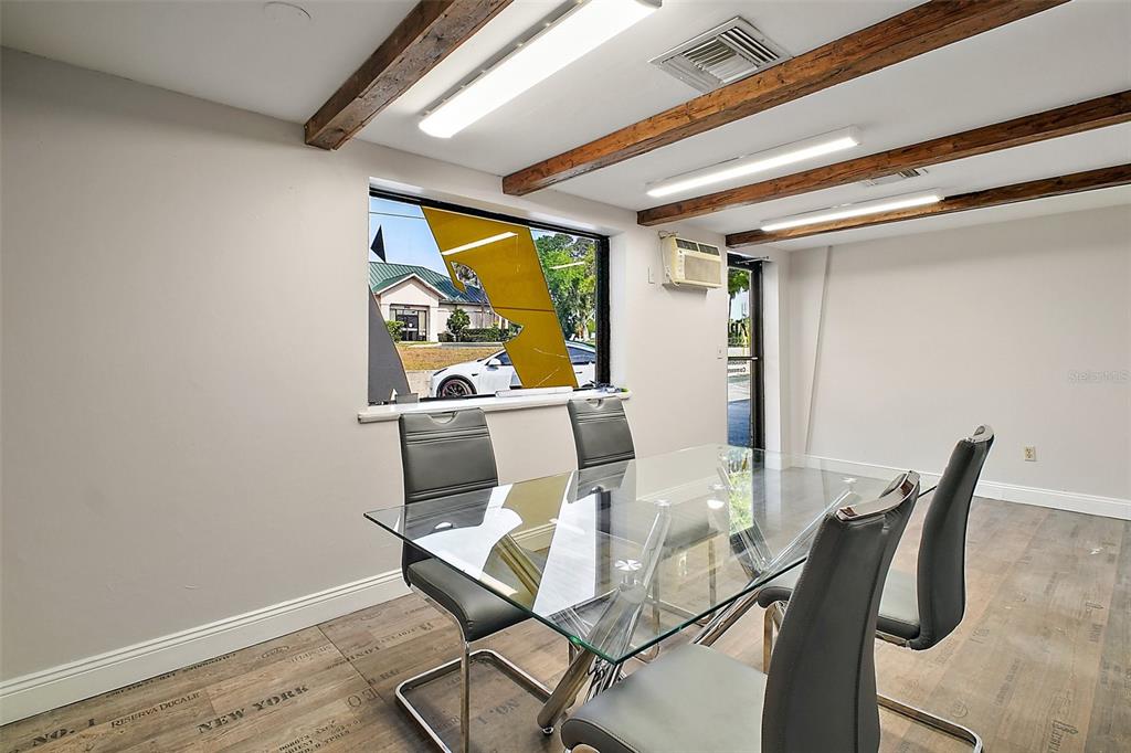 3101 Kurt Street Eustis, FL 32726 - Photo 19 of 43 a dining room with furniture and a window